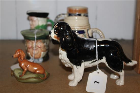 Royal Doulton Parson Brown ash pot, two Toby jugs, Beswick Spaniel & a Dachshund on cushion (6)